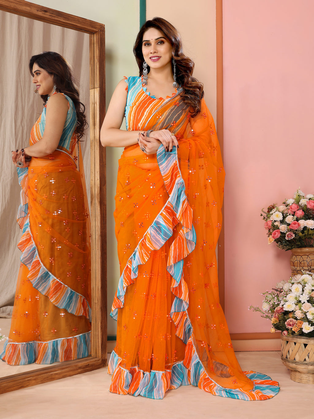 Vibrant Orange Net Saree | Mirror Work Splendor with Ruffle Detailing