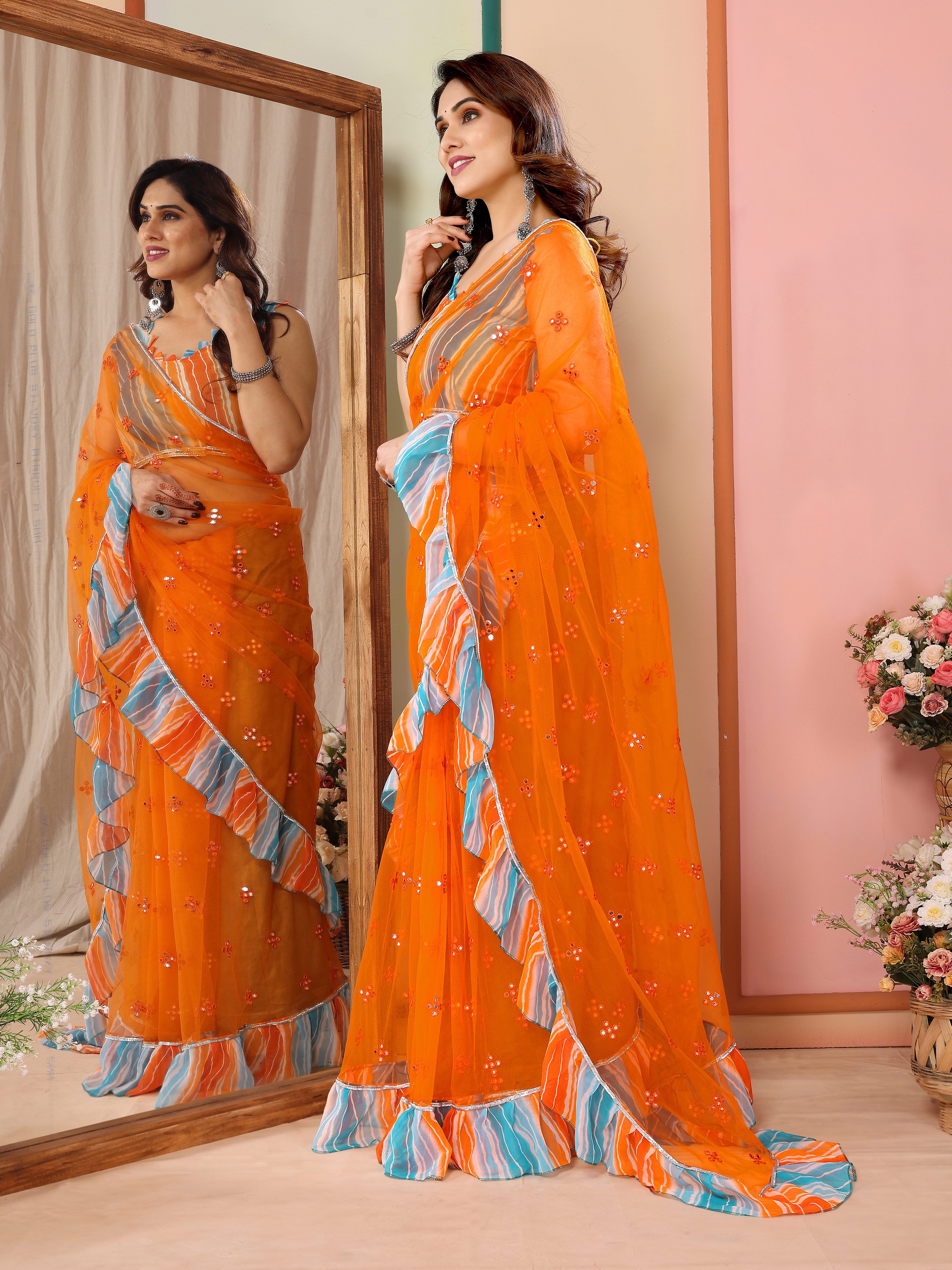 Vibrant Orange Net Saree | Mirror Work Splendor with Ruffle Detailing