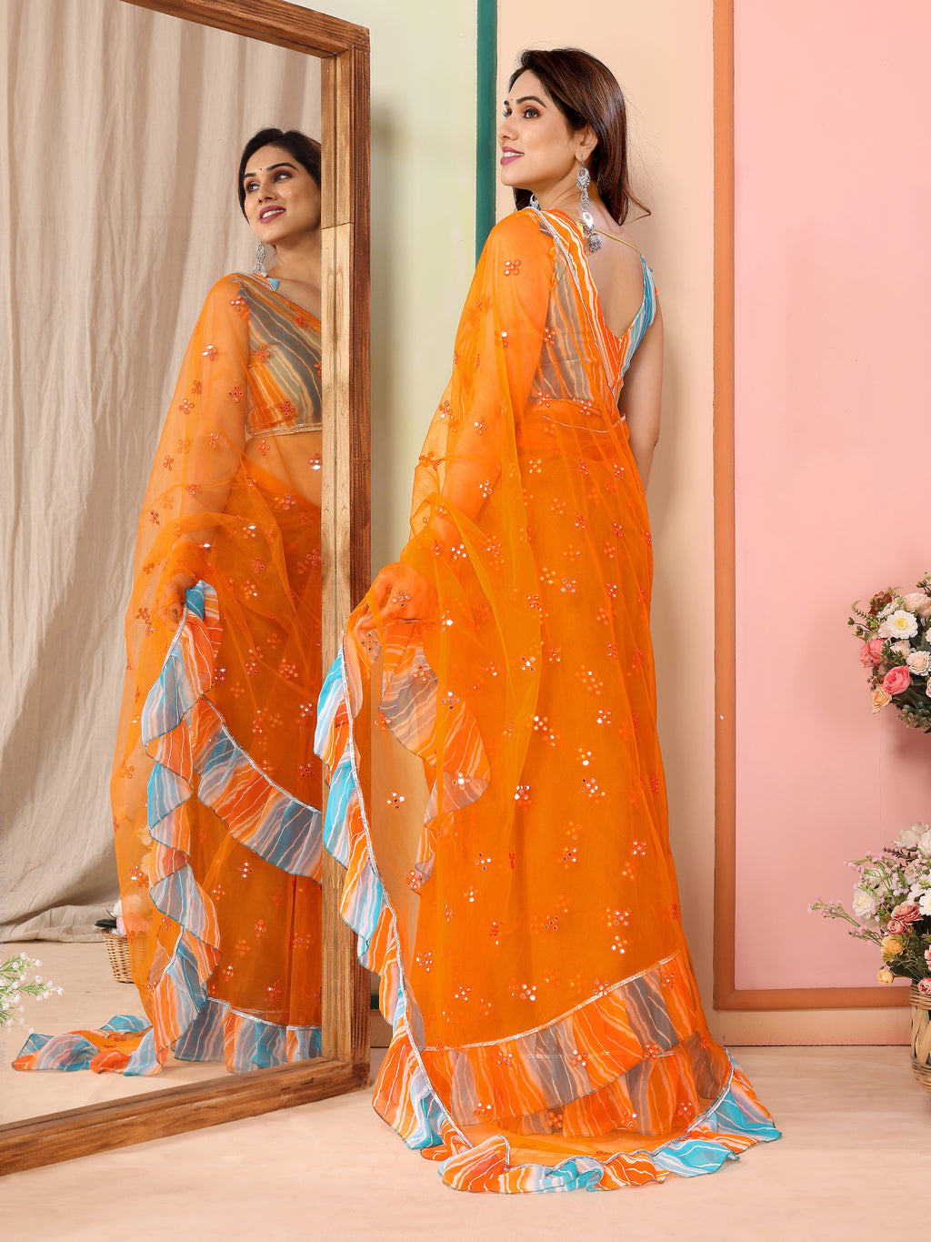 Vibrant Orange Net Saree | Mirror Work Splendor with Ruffle Detailing