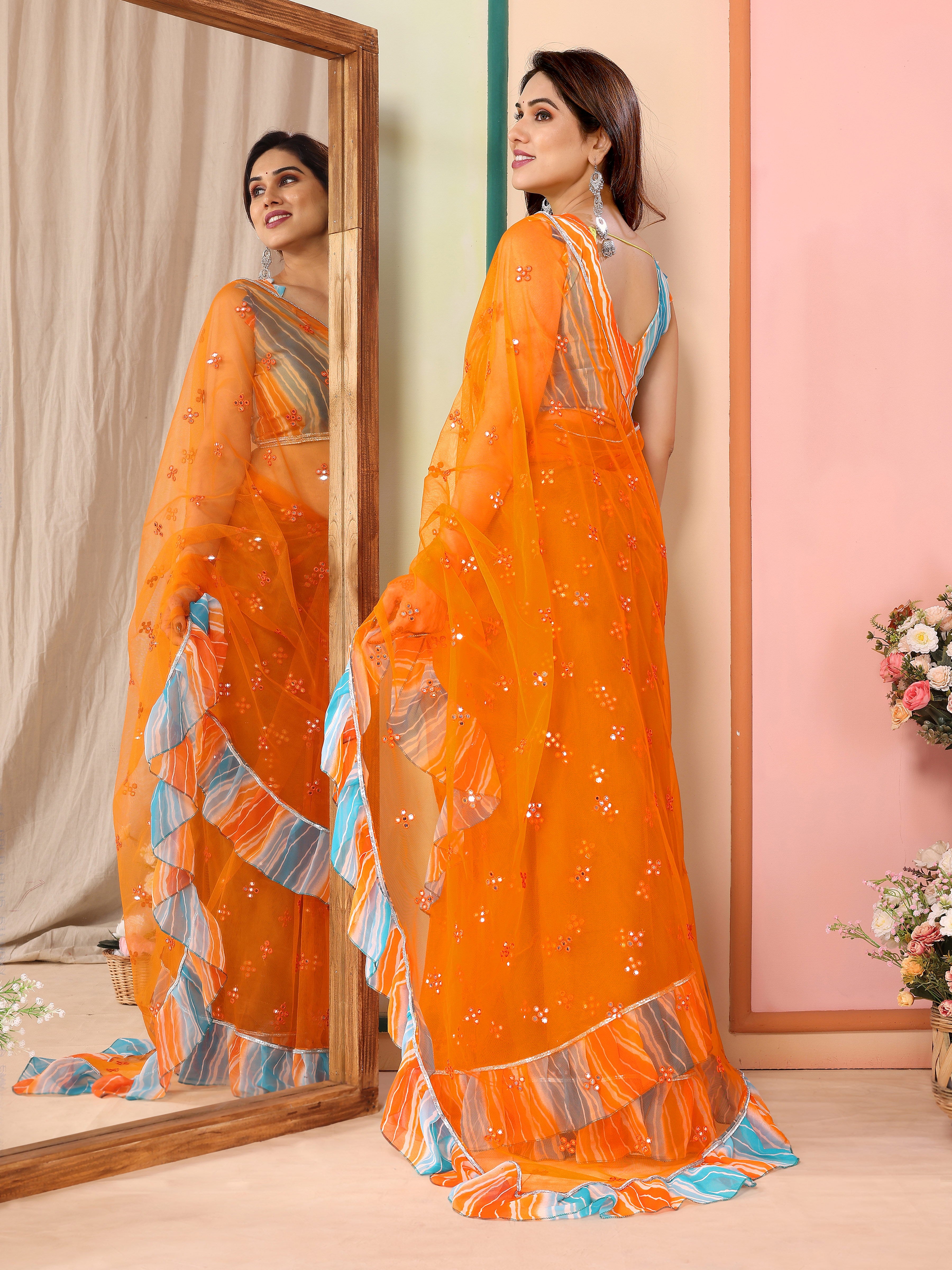 Vibrant Orange Net Saree | Mirror Work Splendor with Ruffle Detailing