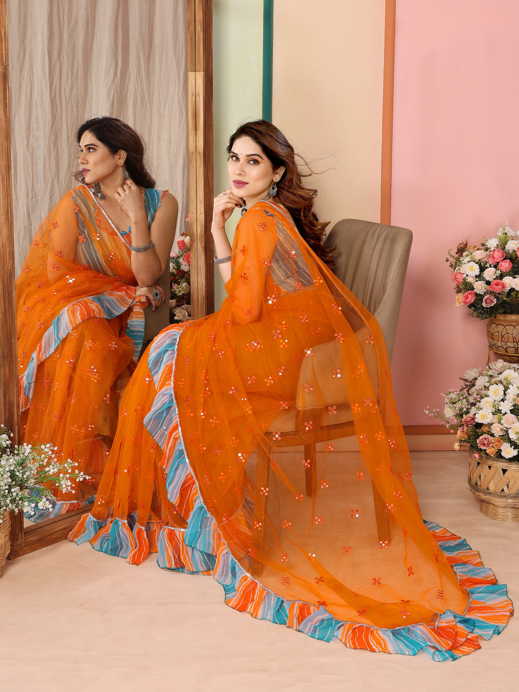 Vibrant Orange Net Saree | Mirror Work Splendor with Ruffle Detailing